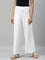 Women Solid White Viscose Mid Rise Knit Palazzos