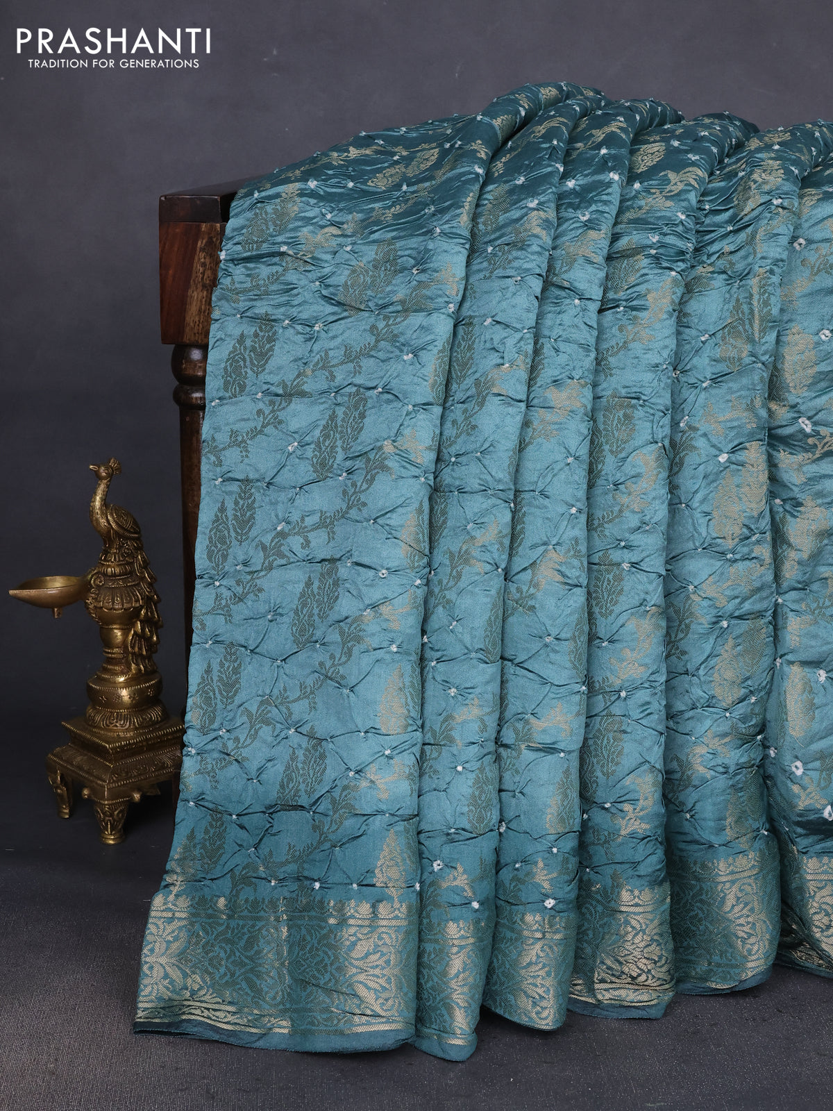 Chiniya silk saree pastel green shade with allover bandhani prints & zari weaves and zari woven border