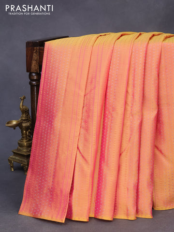 Pure kanchipuram silk saree dual shade of yellowish pink and teal blue with allover zari weaves in borderless style