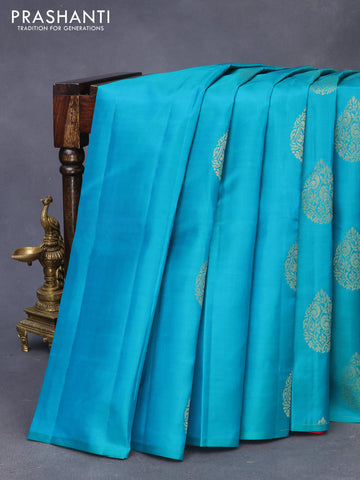 Pure kanchipuram silk saree teal green and pink with zari woven buttas in borderless style