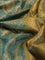 Kanchipuram tissue silk saree dual shade of teal green with allover zari woven brocade weaves and long rich zari woven border