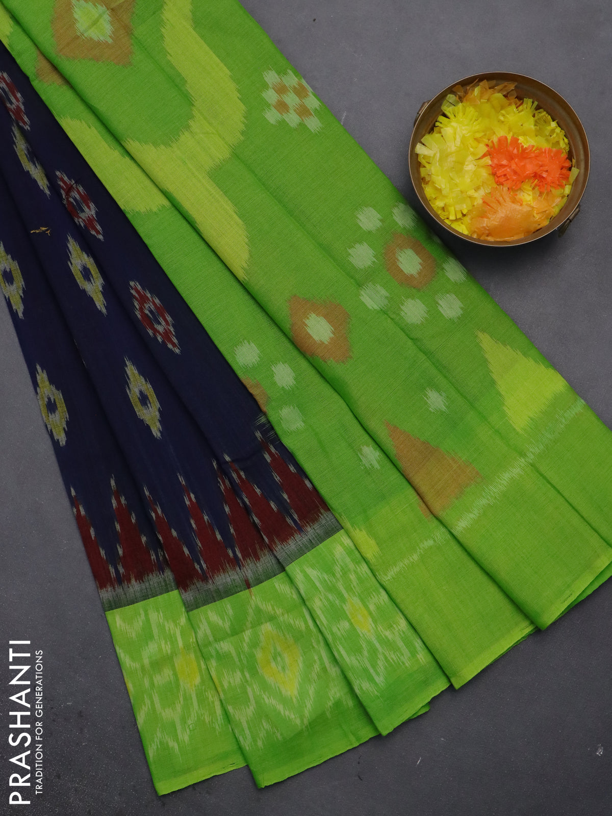 Ikat cotton saree dark blue and light green with allover ikat butta weaves and temple design simple border