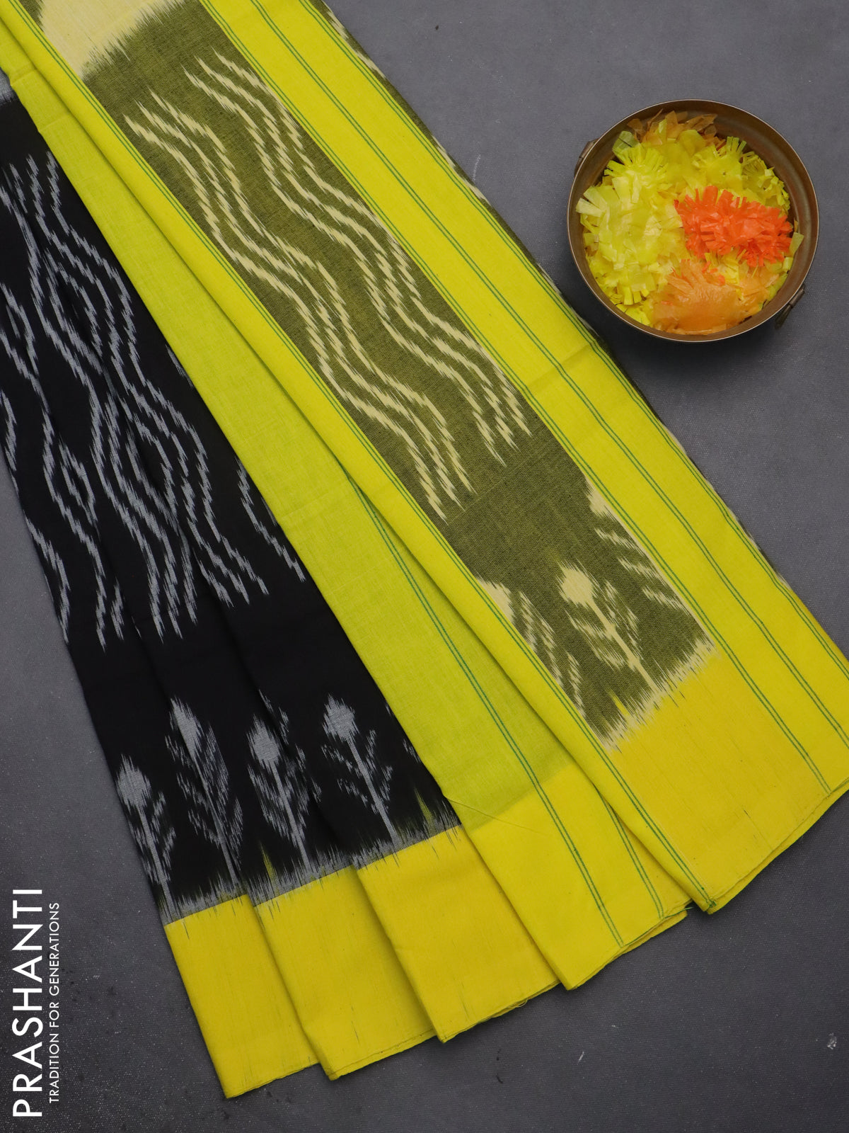 Ikat cotton saree black and yellow with allover ikat weaves and simple border