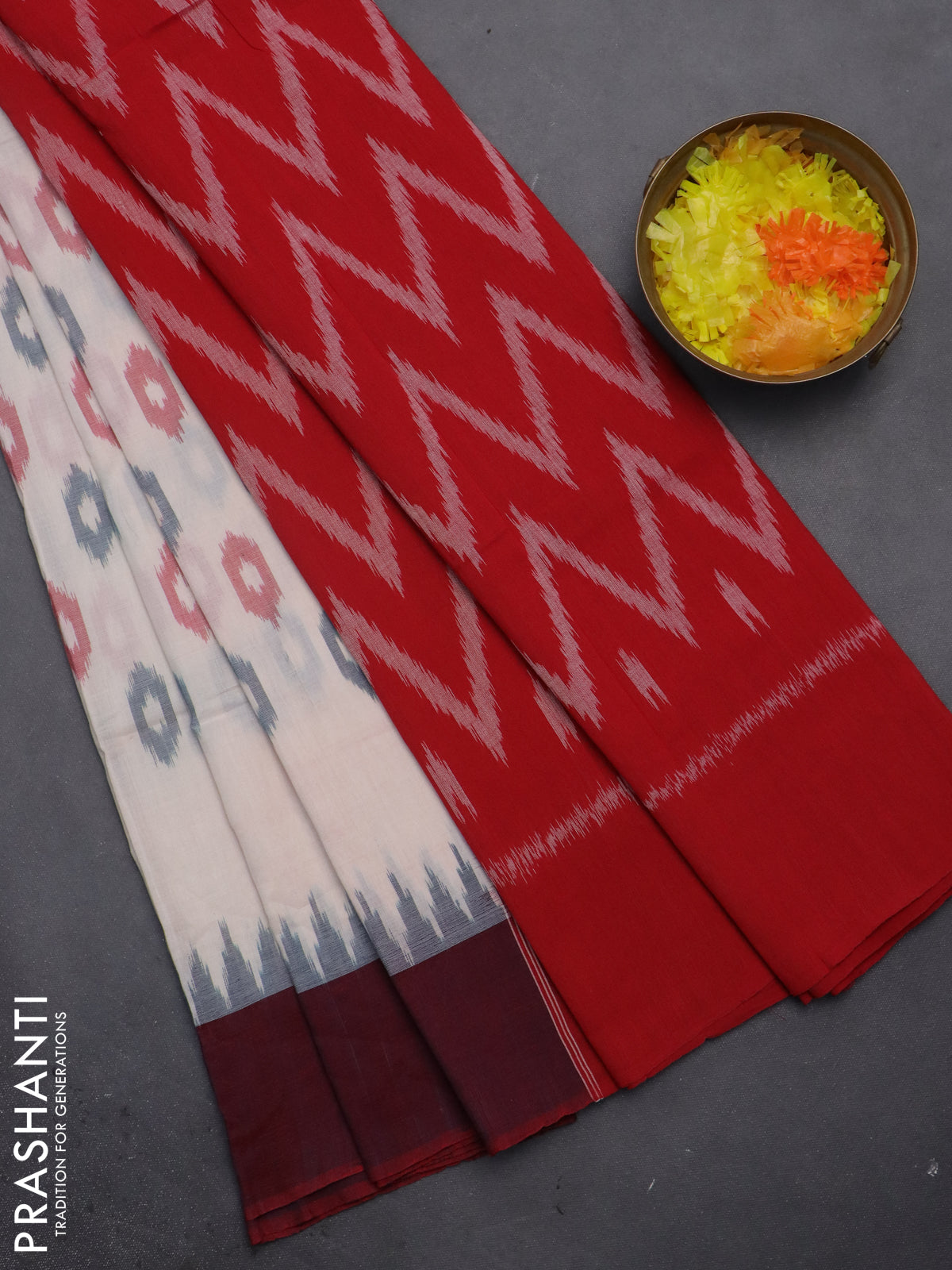 Ikat cotton saree cream and red with allover ikat butta weaves and temple design simple border