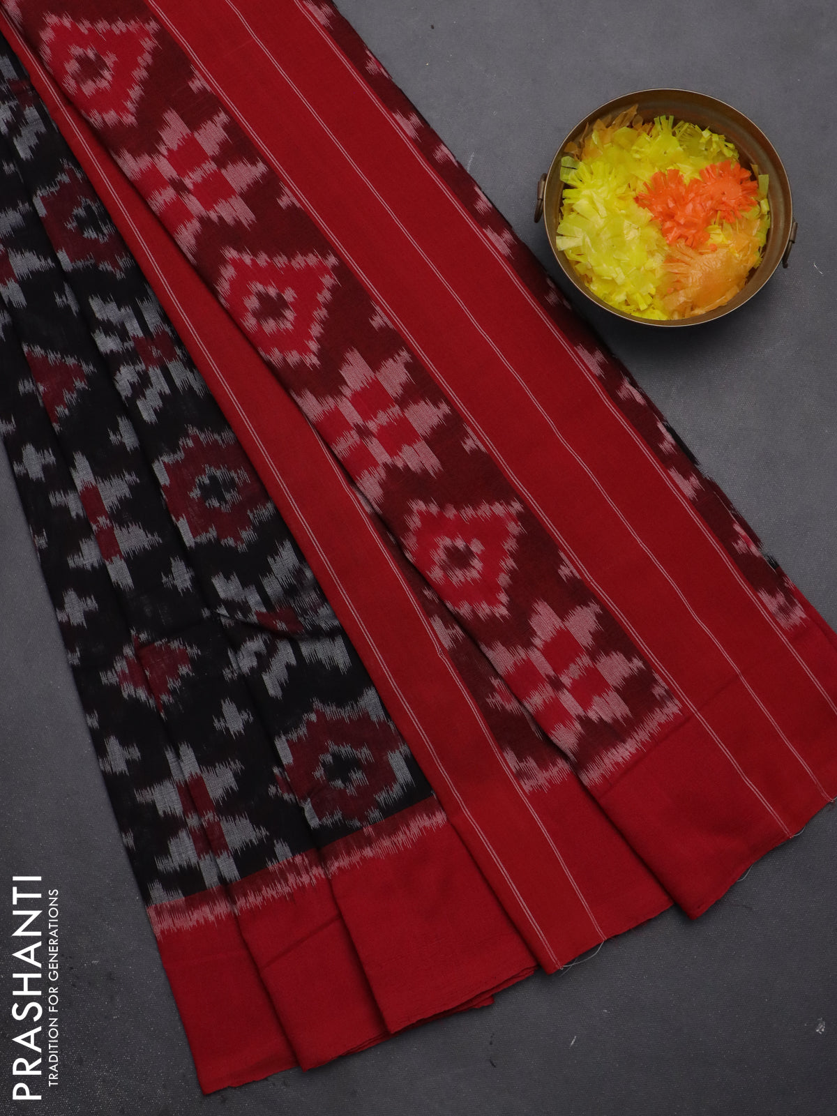 Ikat cotton saree black and red with allover ikat weaves and simple border