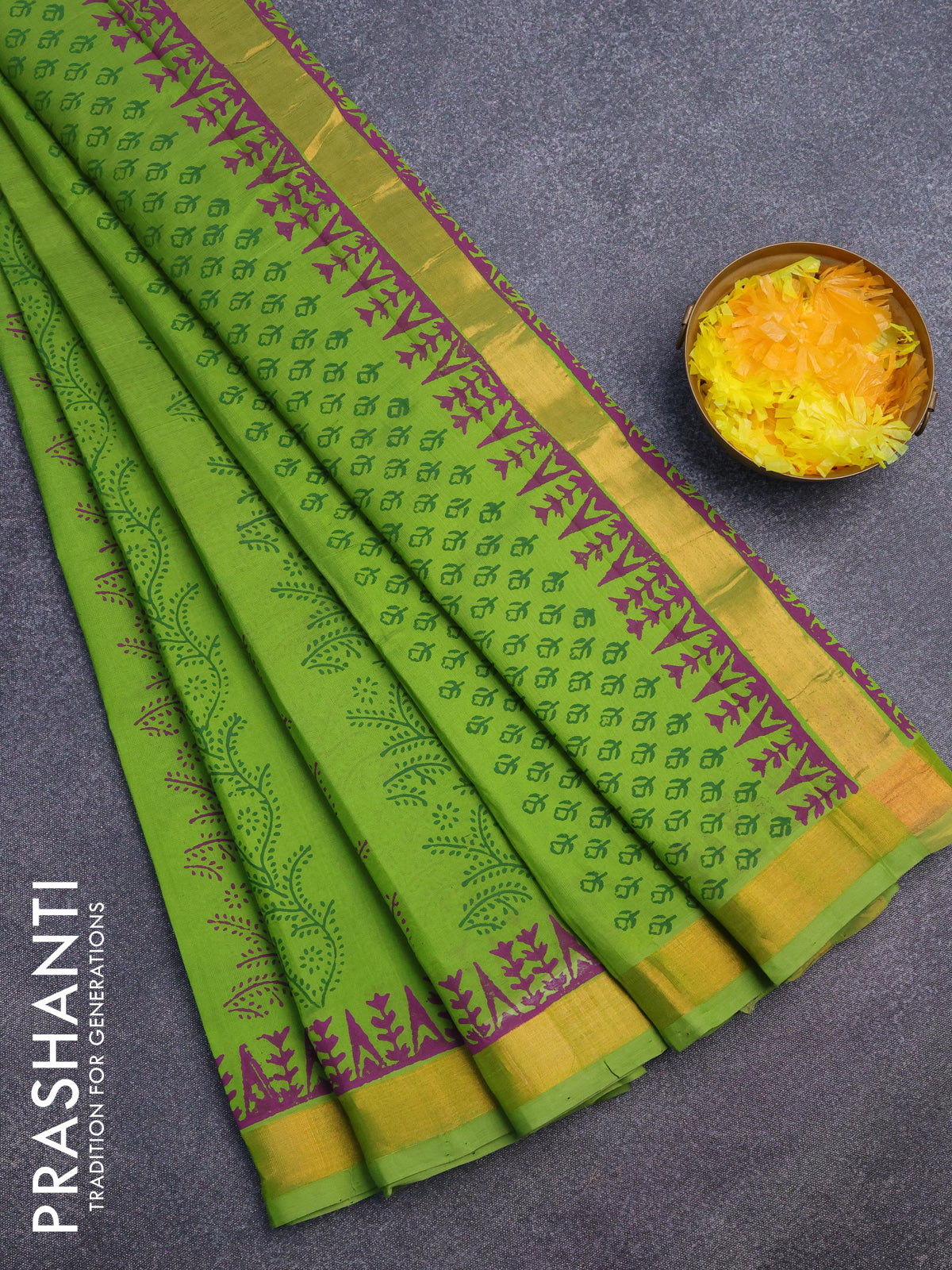 Silk cotton block printed saree light green with allover prints and zari woven border