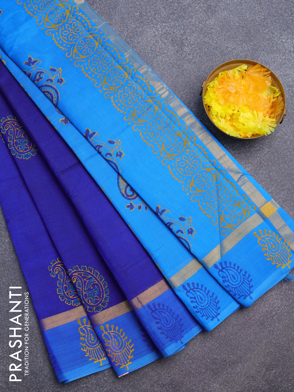 Silk cotton block printed saree blue and cs blue with paisley butta prints and zari woven simple border