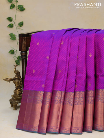 Pure kanjivaram silk saree purple and dual shade of greenish purple with allover self emboss & zari buttas and long copper zari woven border