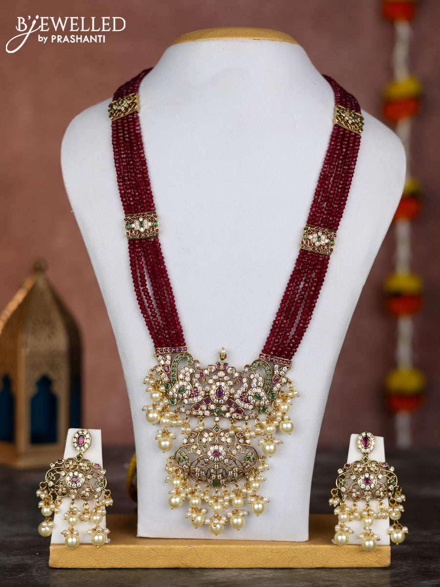 Beaded multilayer maroon necklace with zircon ,kemp & cz stones and pearl hangings