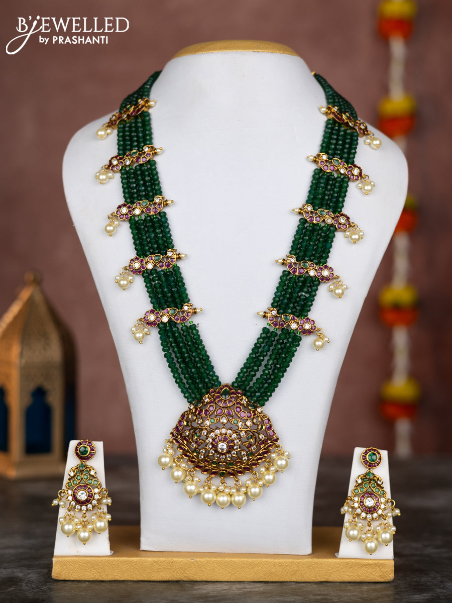Beaded multilayer green necklace with kemp & cz stones and pearl hangings in victorian finish