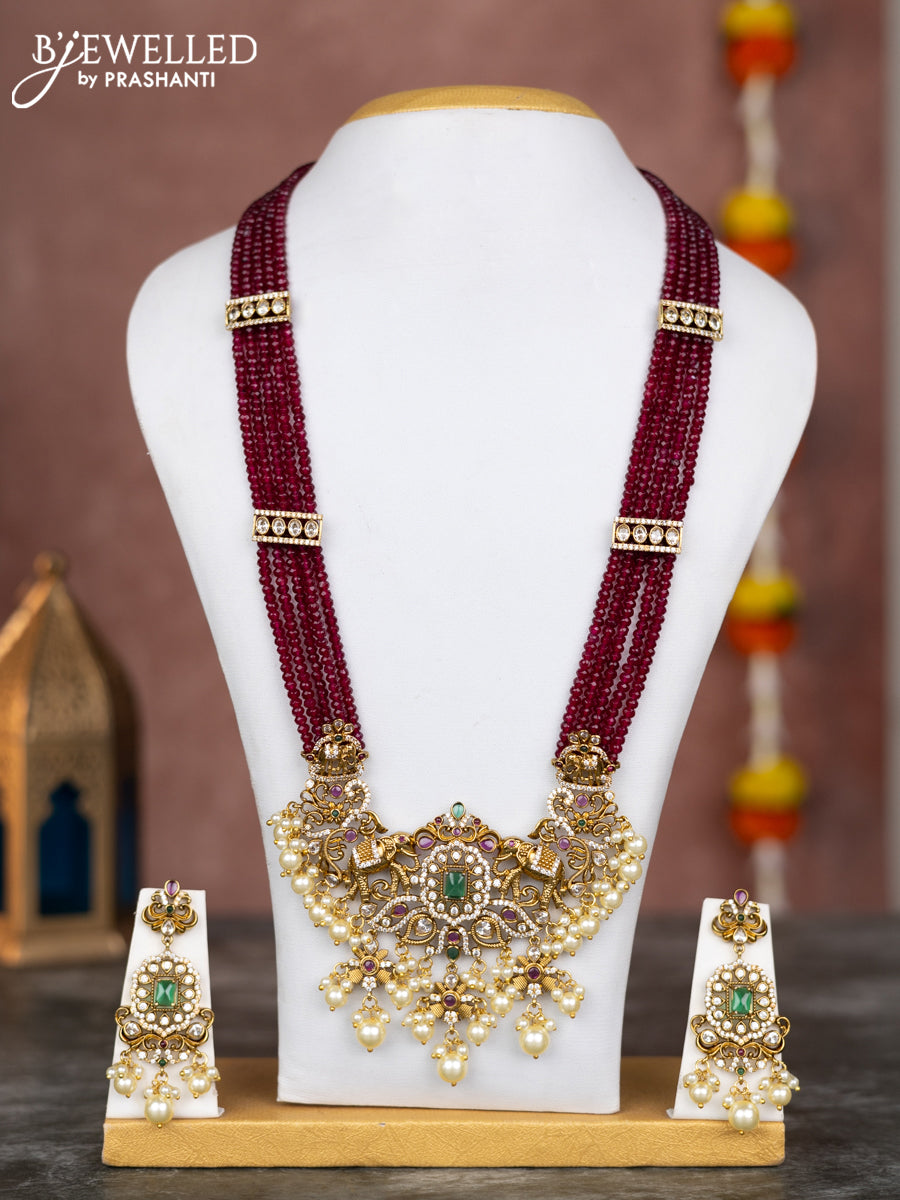 Beaded multilayer maroon necklace elephant design with kemp & cz stones and pearl hangings in victorian finish