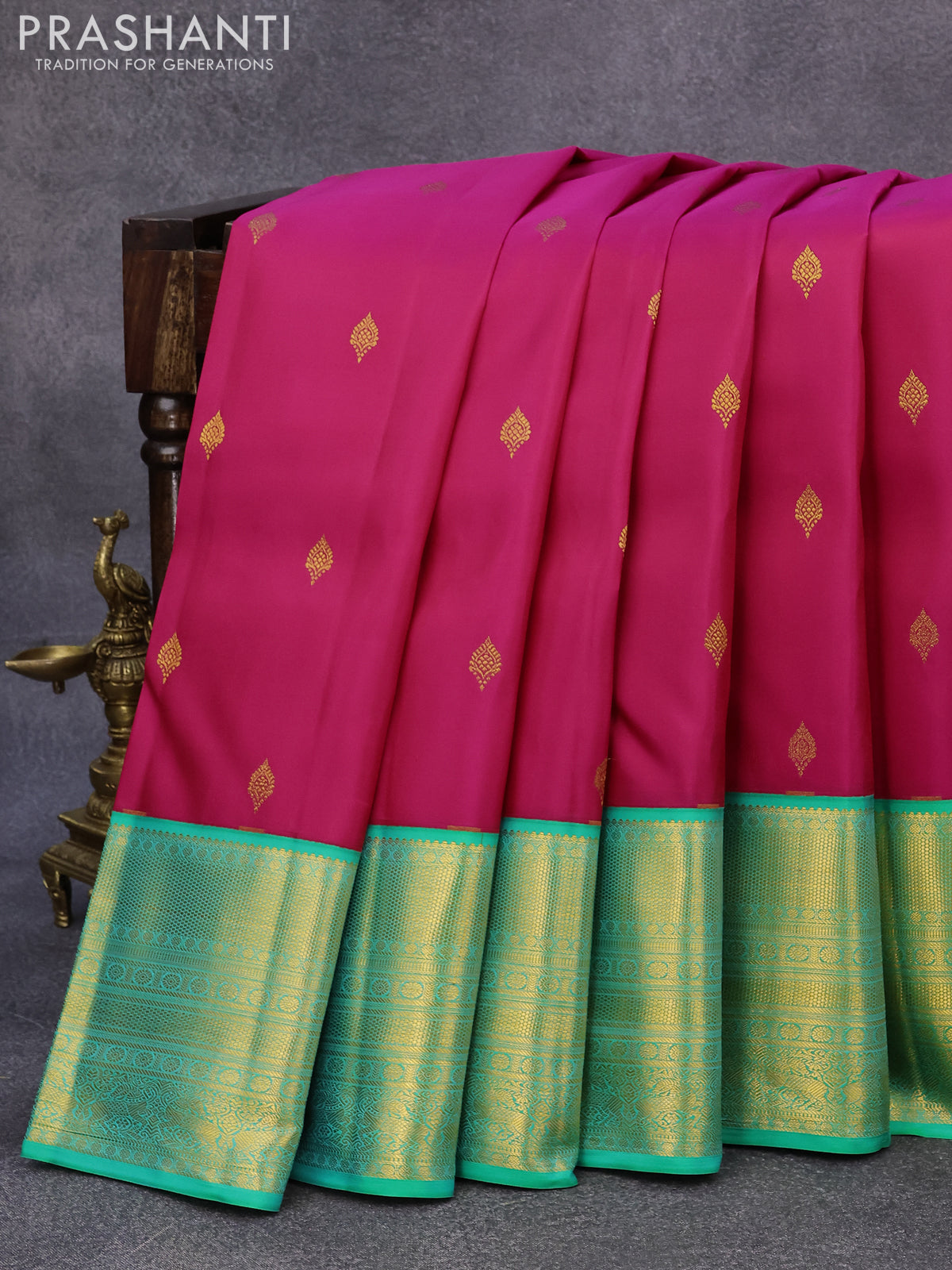 Pure kanjivaram silk saree magenta pink and teal green shade with allover zari woven buttas and long rich zari woven border butta style