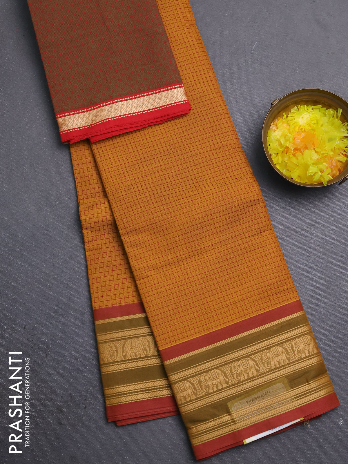 Chettinad cotton saree dark mustard and sap green with allover cheked pattern and thread woven border
