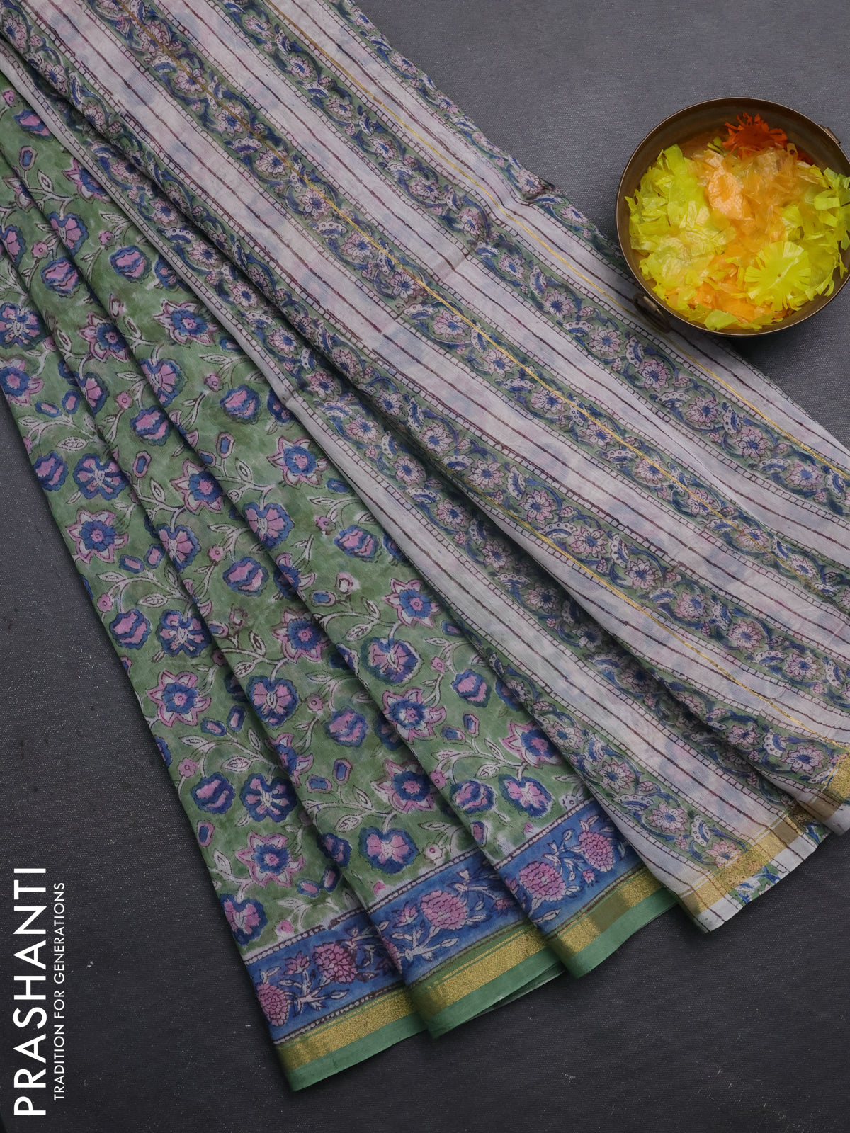Chanderi bagru saree pastel green with allover floral prints and small zari woven border