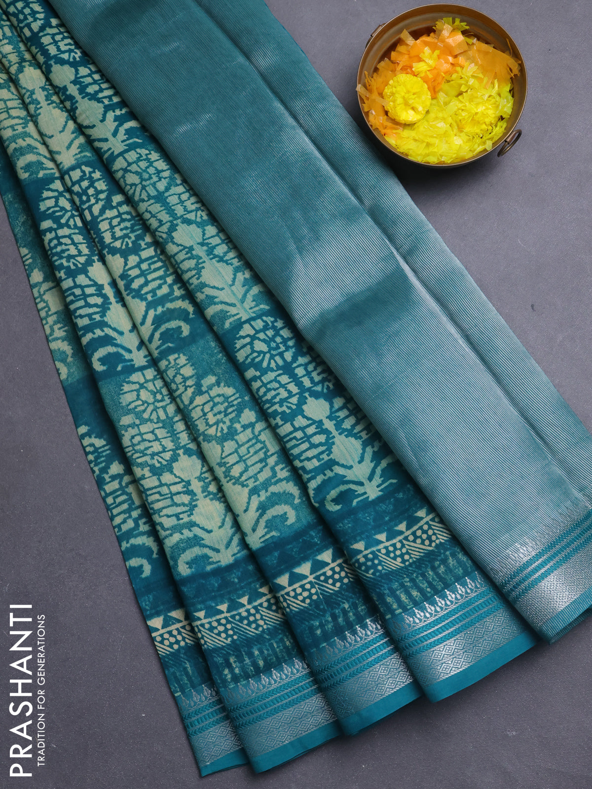 Chanderi silk cotton saree teal green with allover prints and silver zari woven border