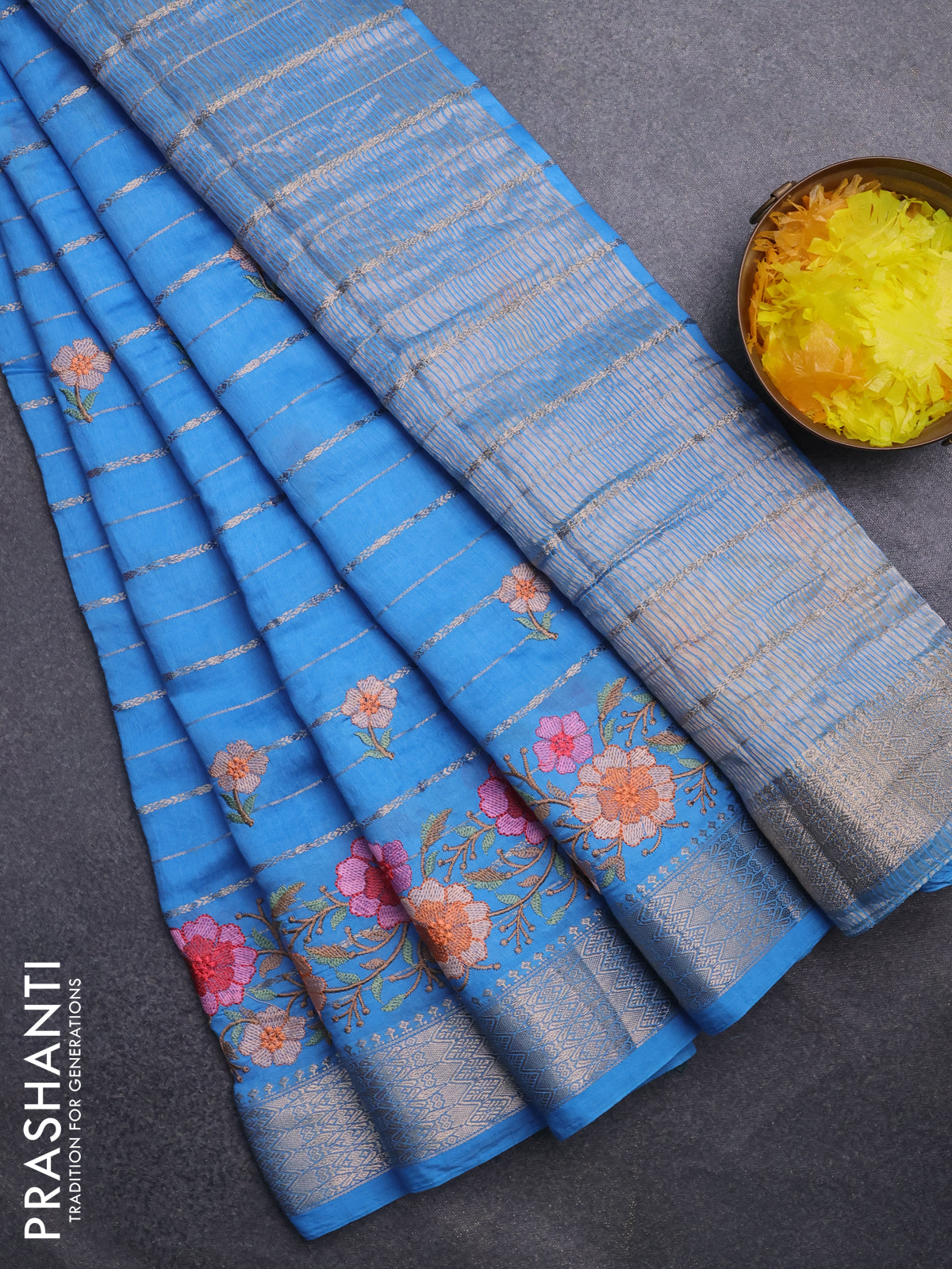 Assam silk saree blue shade with allover zari weaves & floral embroidery work buttas and zari woven border