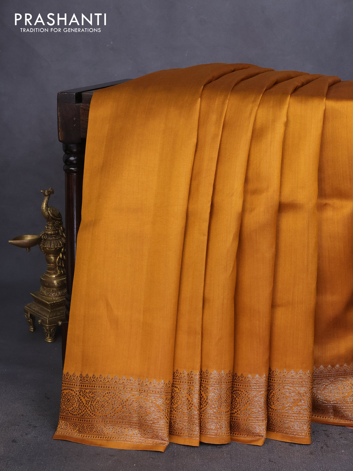 Chiniya silk saree dark mustard and rust shade with plain body and woven border