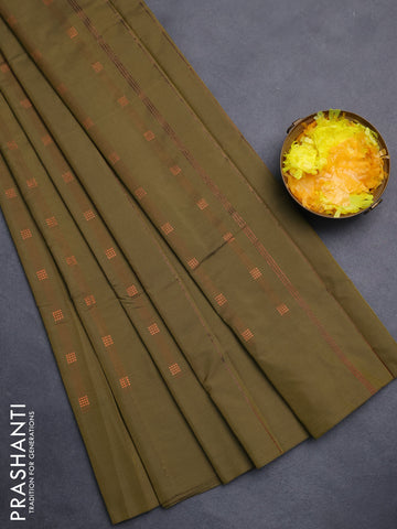 Arani semi silk saree sap green with copper zari woven buttas in borderless style
