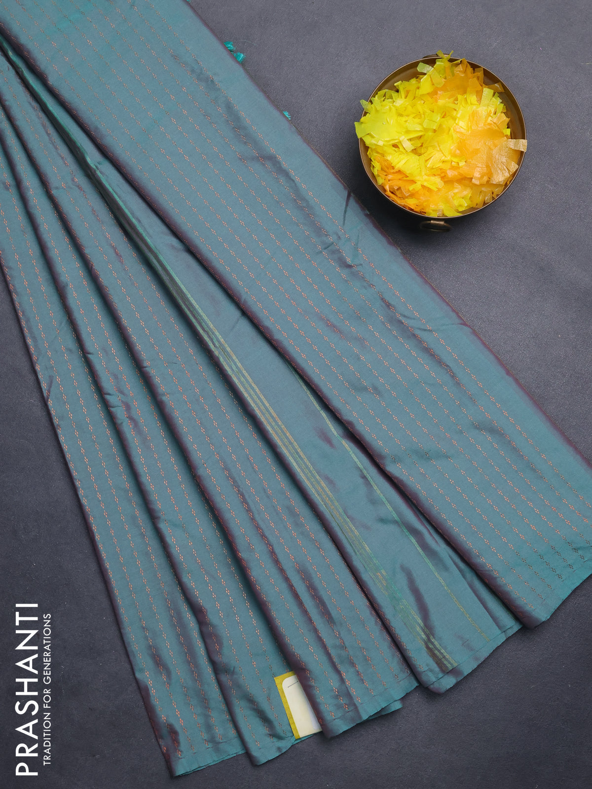 Arani semi silk saree dual shade of teal green with allover copper zari weaves in borderless style