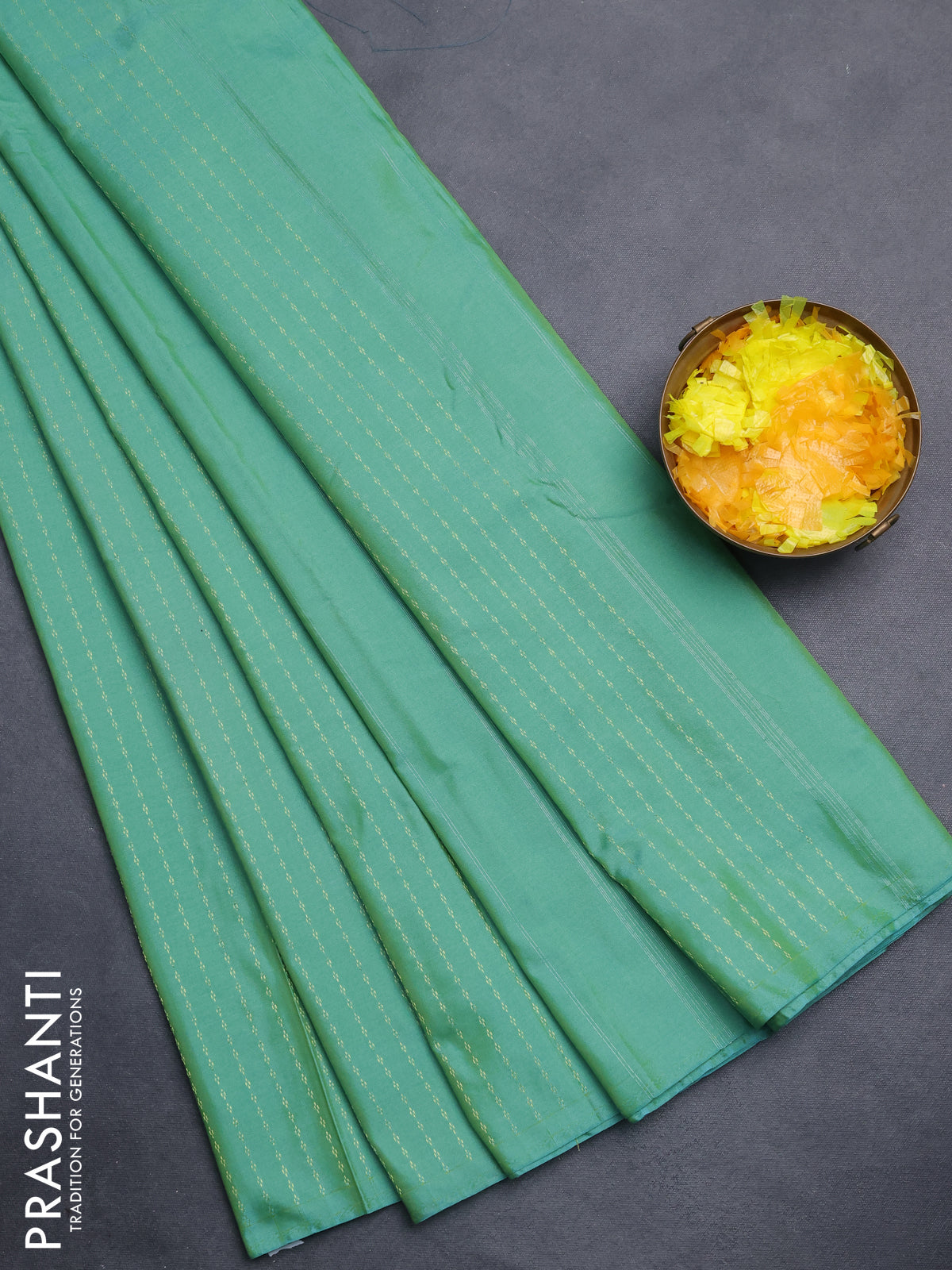 Arani semi silk saree teal green with allover zari weaves in borderless style