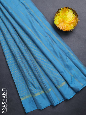 Arani semi silk saree blue shade with allover small zari checked pattern and zari woven simple border