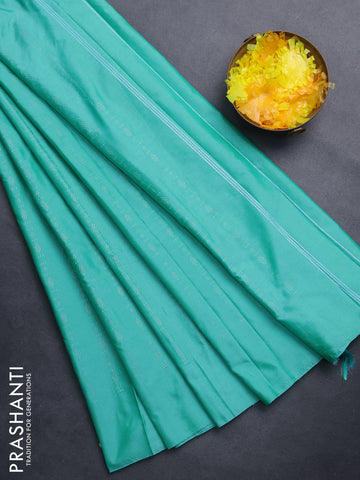 Arani semi silk saree teal green with allover silver zari weaves in borderless style