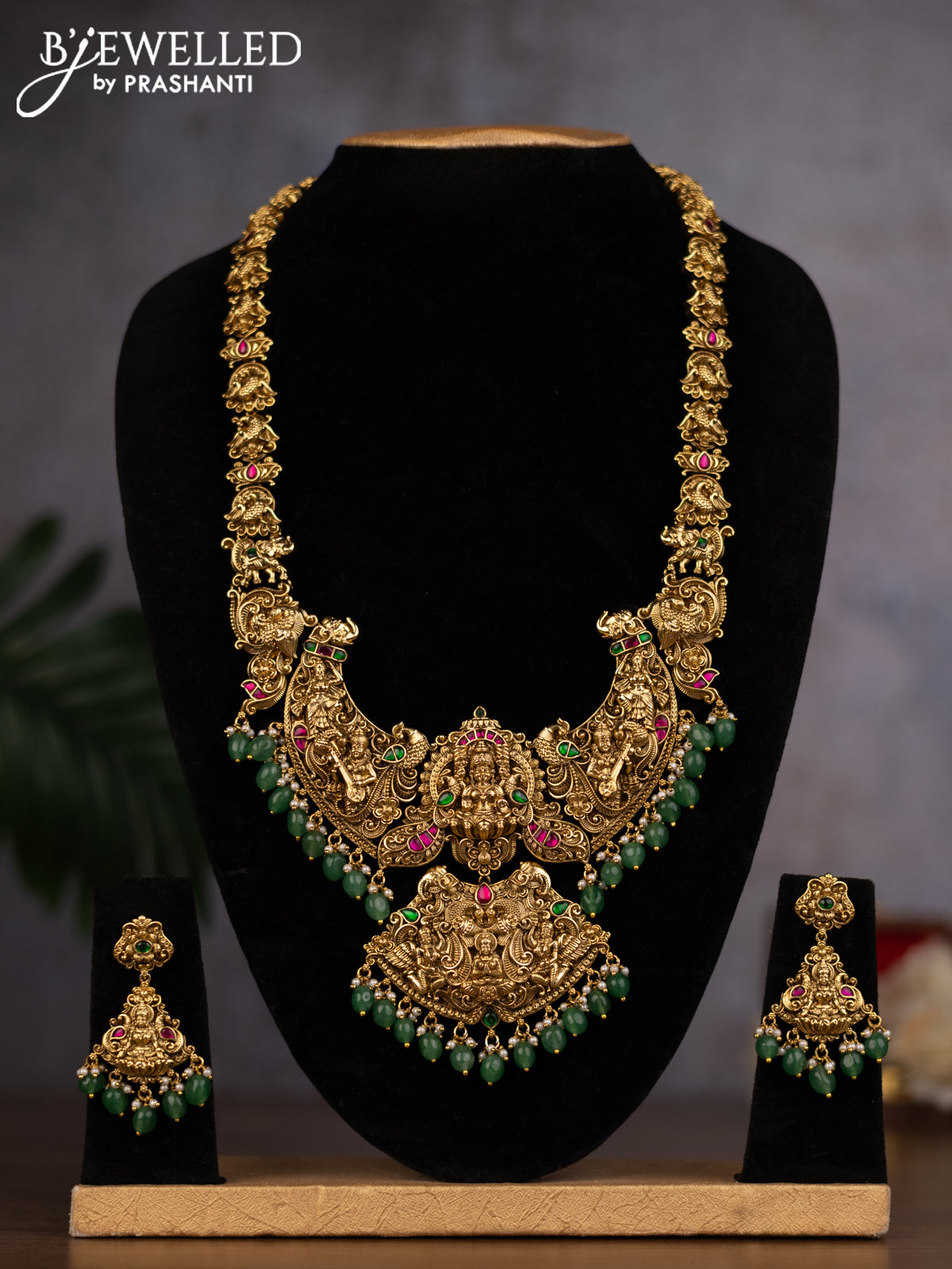 Antique haaram lakshmi design with jadau stones and green beads hanging