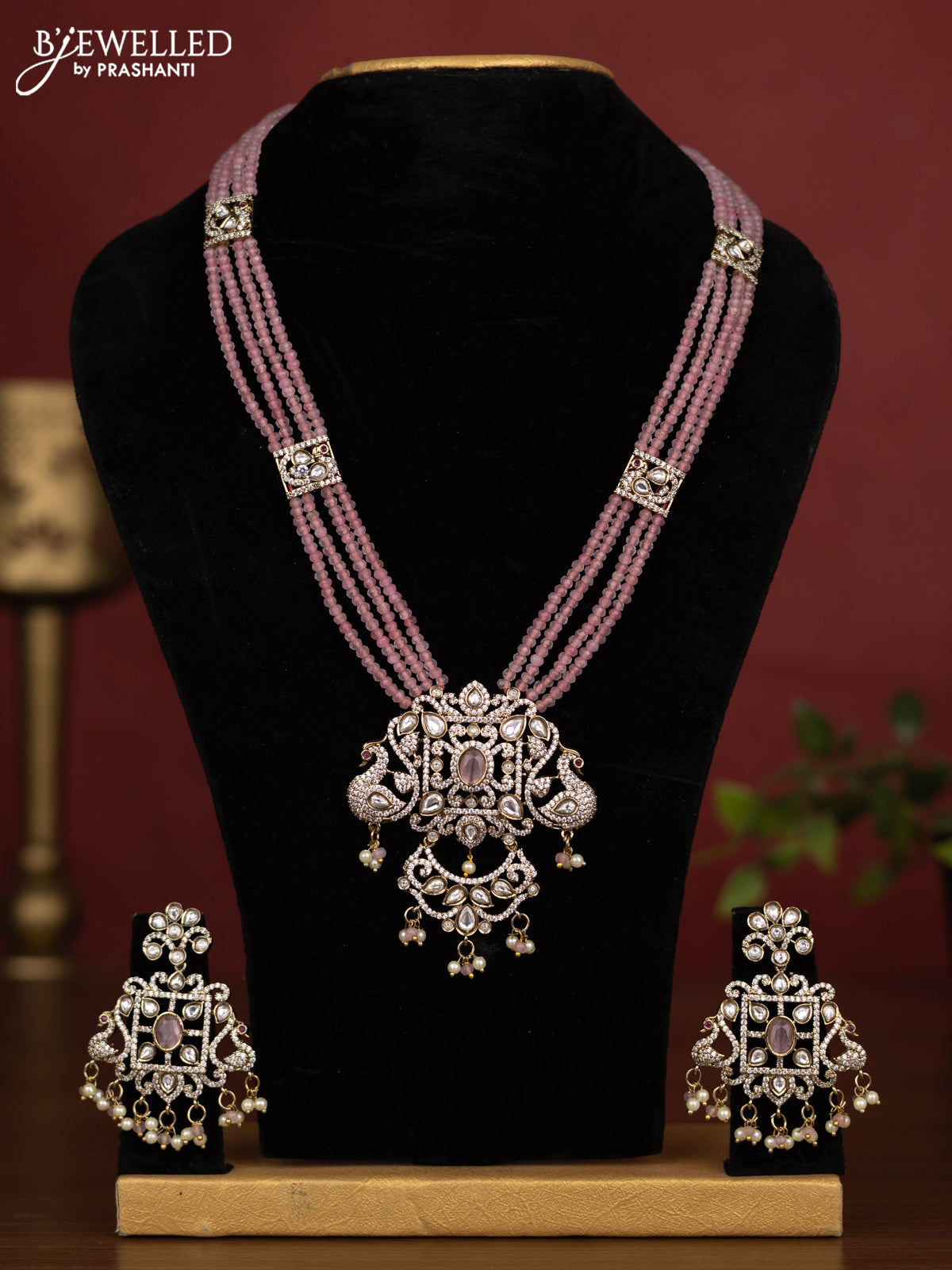 Beaded multilayer baby pink necklace with kundan & cz stones and pearl & beads hanging in victorian finish