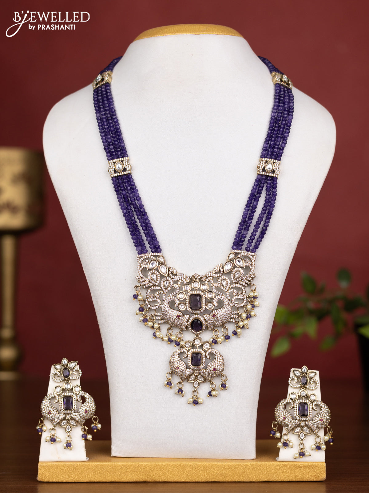 Beaded multilayer violet necklace with kundan & cz stones and pearl & beads hanging in victorian finish