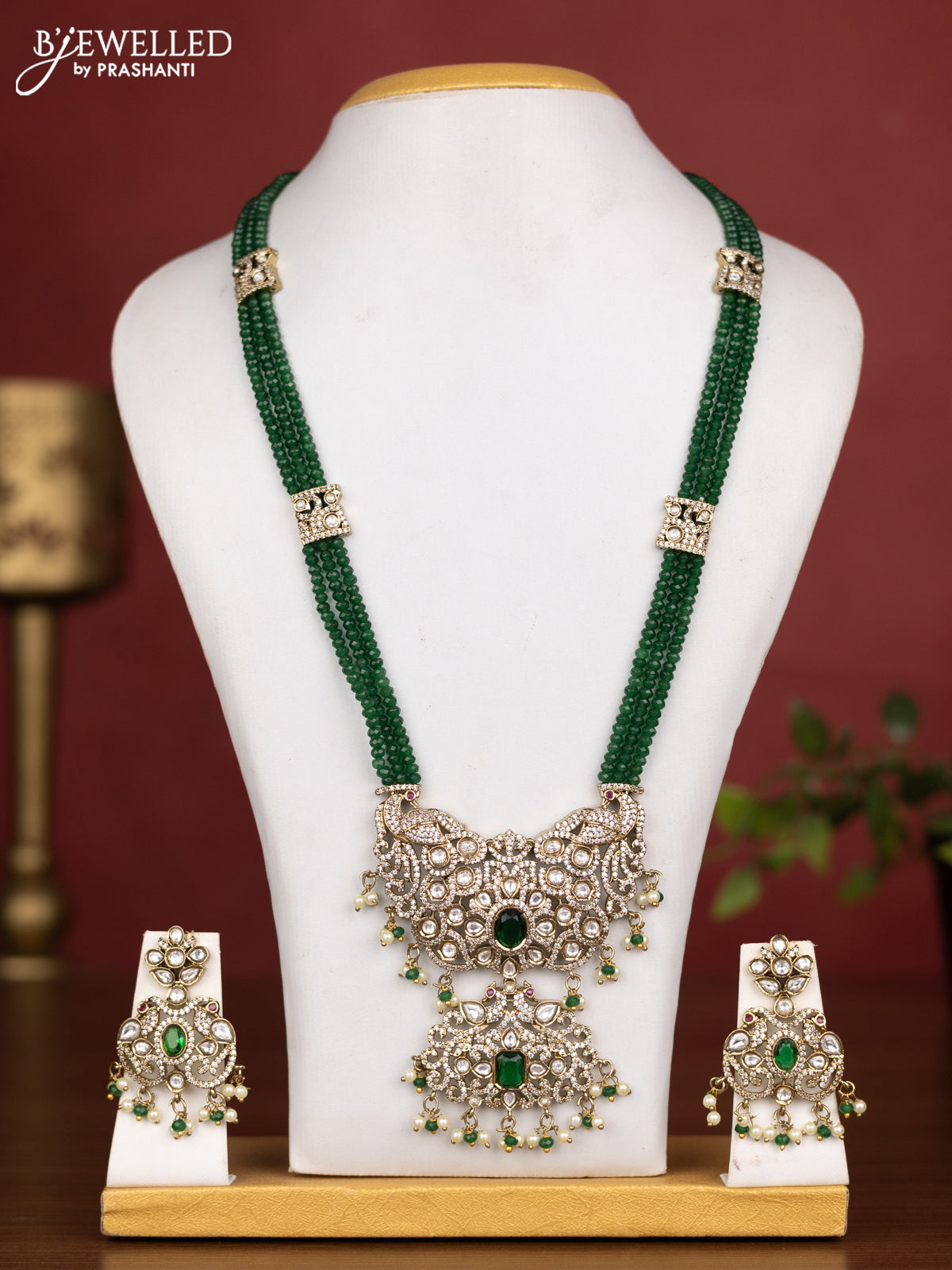 Beaded triple layer green necklace peacock design with emerald kundan & cz stones and pearl & beads hanging