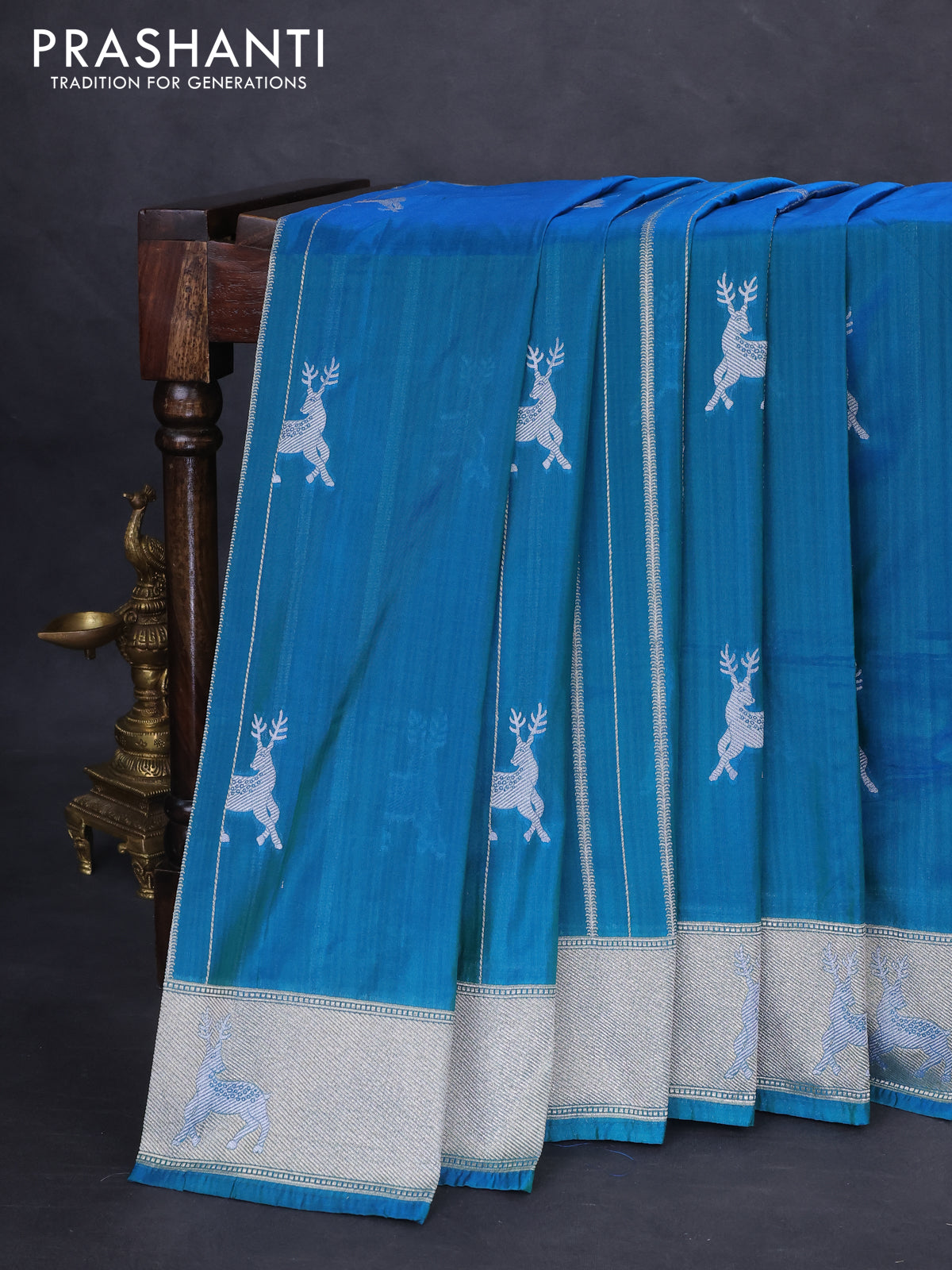 Banarasi semi katan silk saree dual shade of teal bluish green with allover silver & gold zari weaves and deer design zari woven border