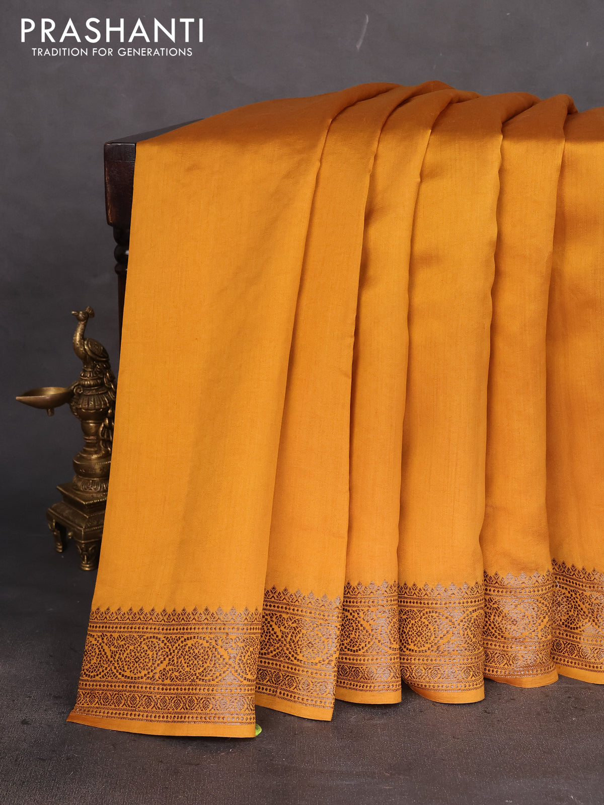 Chiniya silk saree dark mustard with plain body and woven border