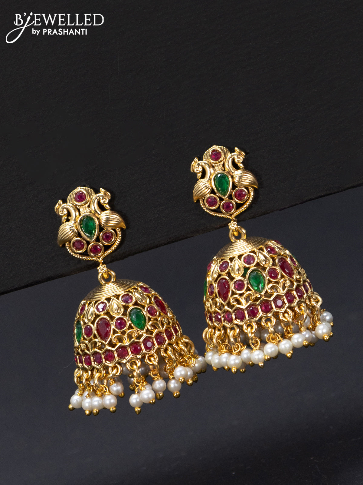 Antique jhumka peacock design with kemp stones and pearl hangings