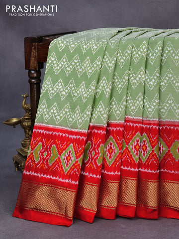 Pochampally silk saree pastel green and red with allover ikat weaves and ikat woven zari border