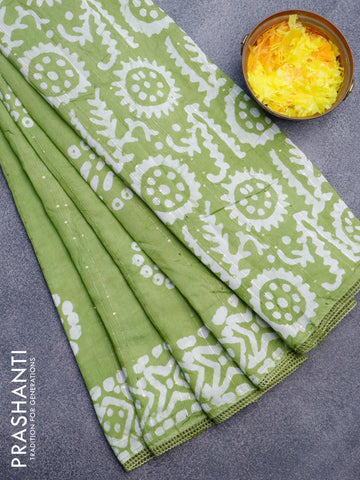 Batik cotton saree green with allover sequin work & batik butta prints and printed lace work border