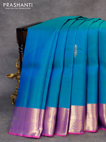 Pure kanjivaram silk saree dual shade of bluish green and purple with zari woven buttas and zari woven border & butta style