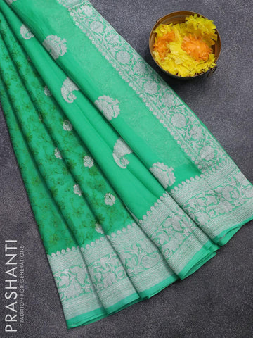 Banarasi chiffon saree teal green   with allover chikankari work and silver zari woven border