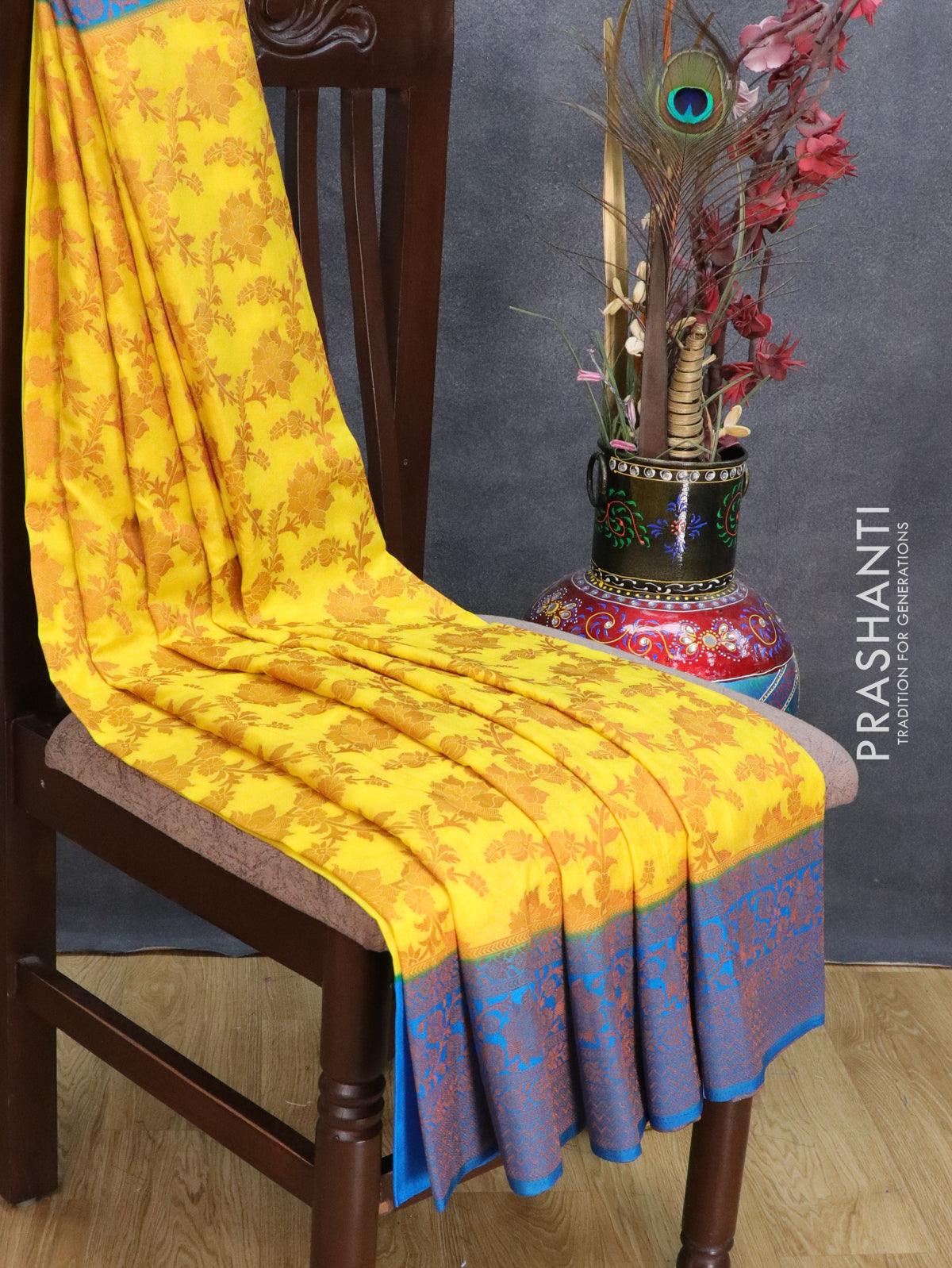 Banarasi semi crepe saree yellow and cs blue with allover copper zari floral weaves and floral copper zari woven border