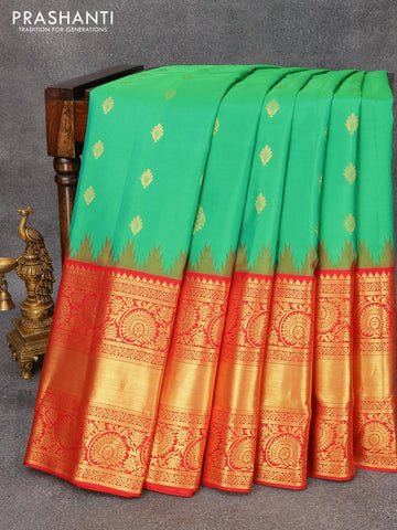 Pure gadwal silk saree green and red with allover zari woven buttas and temple design long zari woven floral border