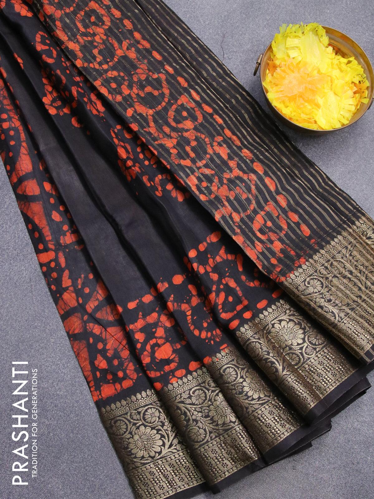 Semi dola saree black and orange with allover batik prints and kanjivaram  style border