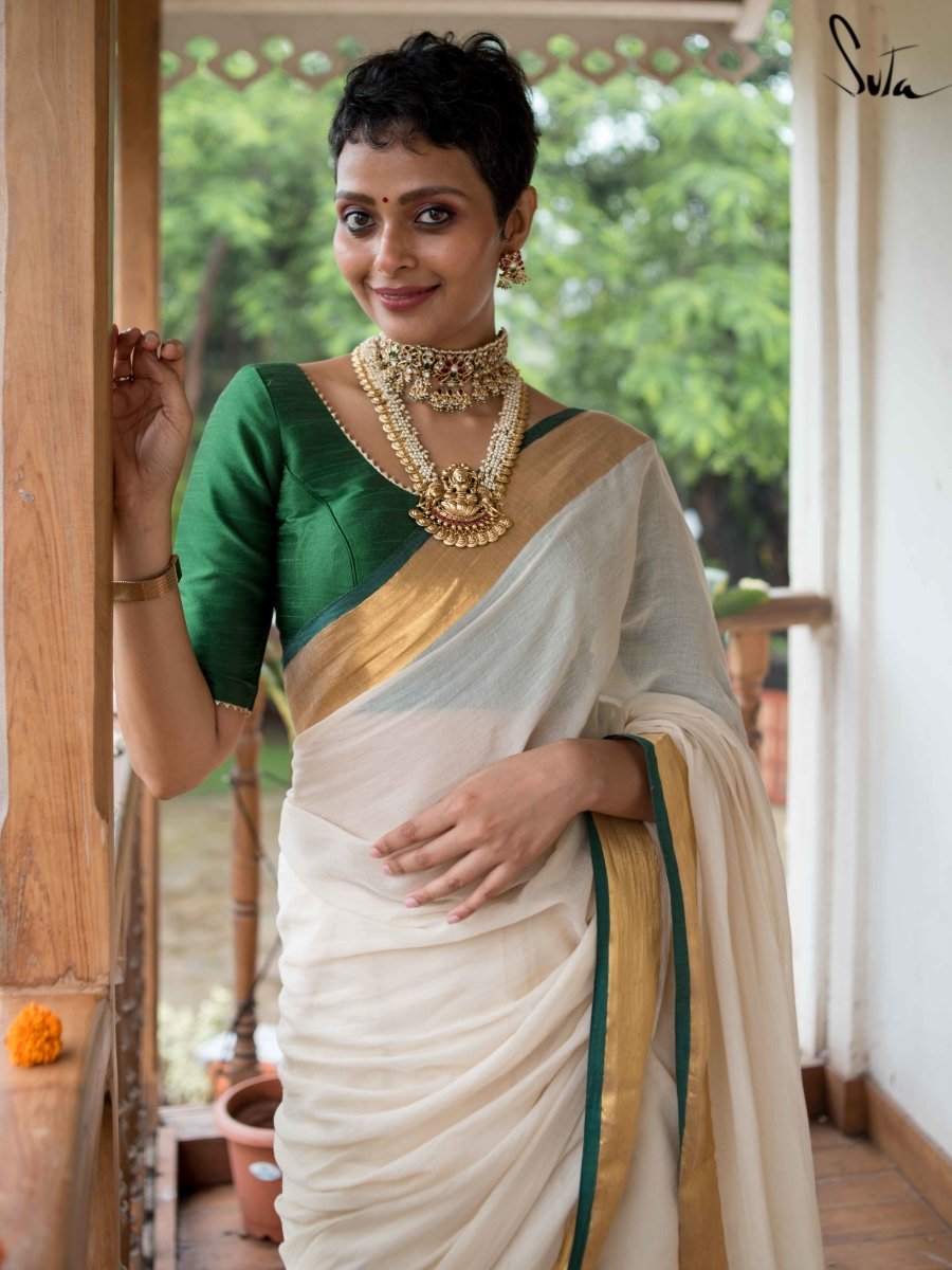 In a kerala style white color saree, contrast green color elbow length  sleeve blouse de… | Designer saree blouse patterns, Bridal blouse designs,  Indian bridesmaids
