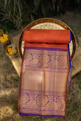 Varamahalakshmi Rust Orange & Purple Kuppadam Checks And Buttis Saree